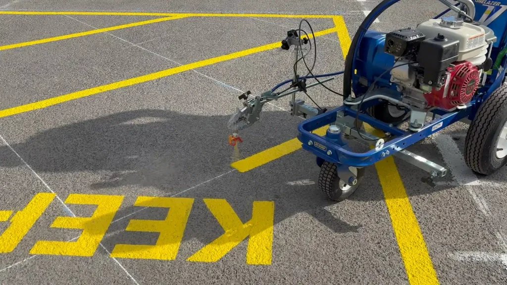Road line marking machine in action